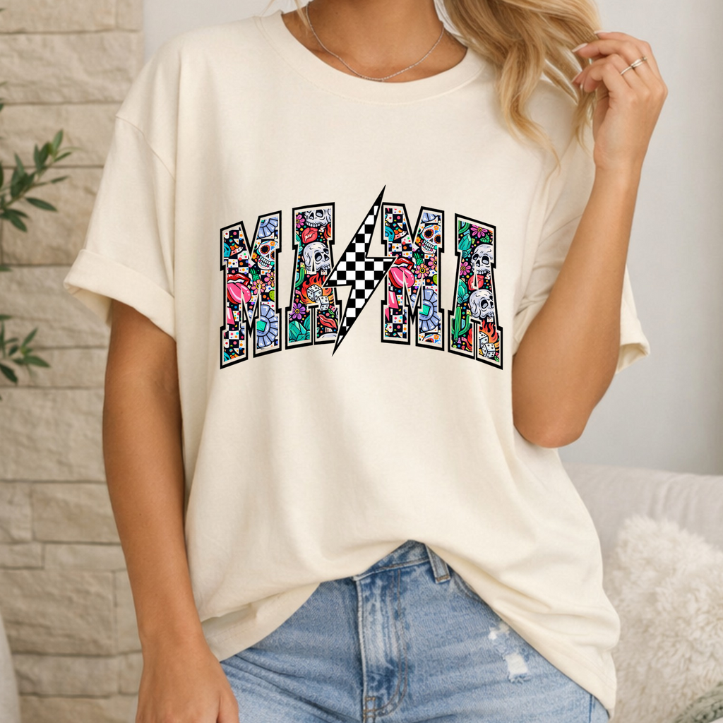 Person wearing a white t-shirt with colorful 'MAMA' design and ripped jeans in a home setting.